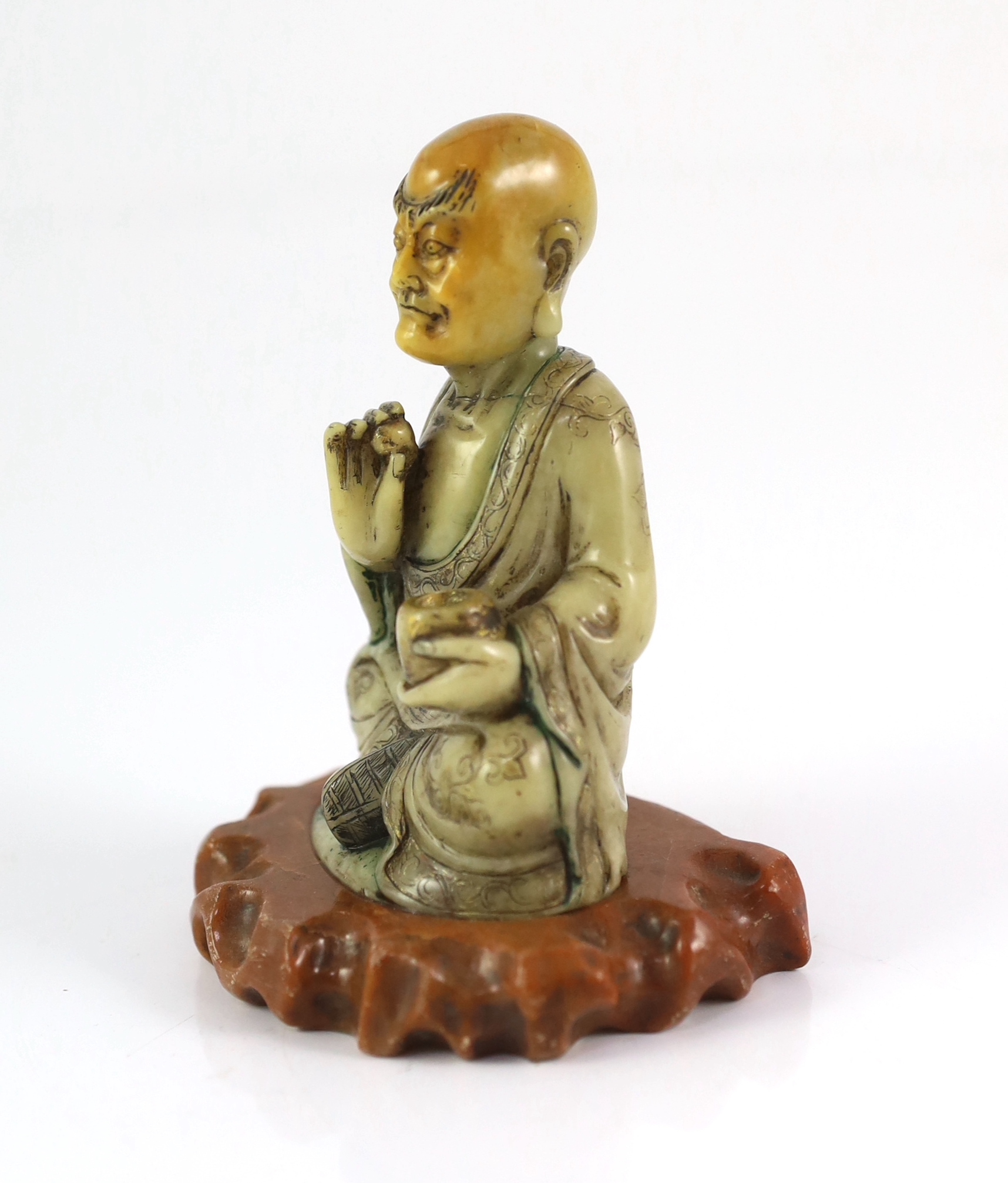 A Chinese soapstone seated figure of a luohan, 18th century